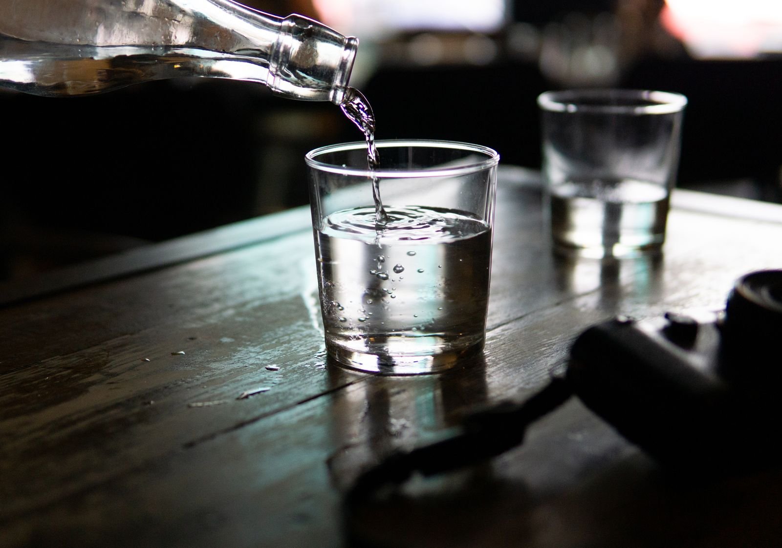 Water being poured into a drinking glass
