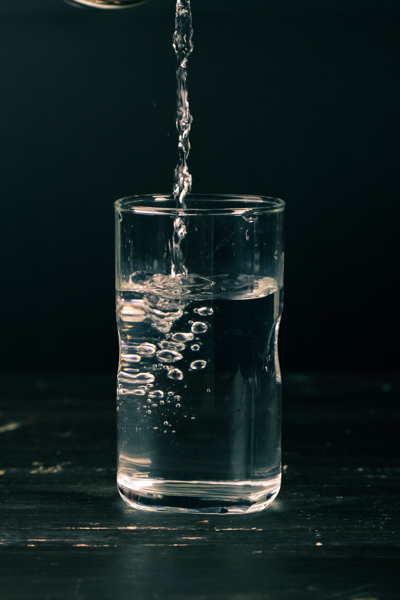 Clear water pouring into a glass